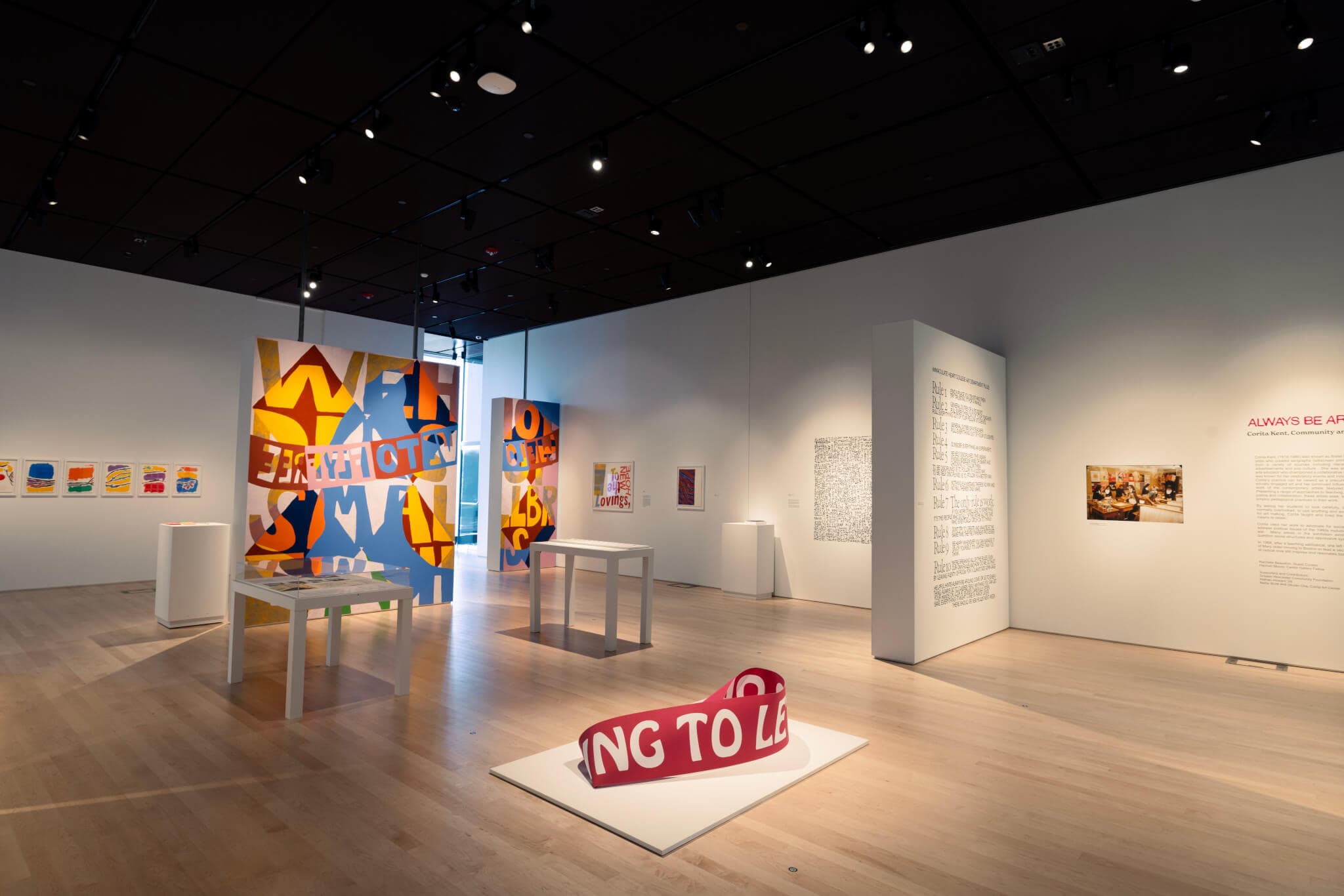 Corita Kent's installation features brightly colored works that incorporate text.