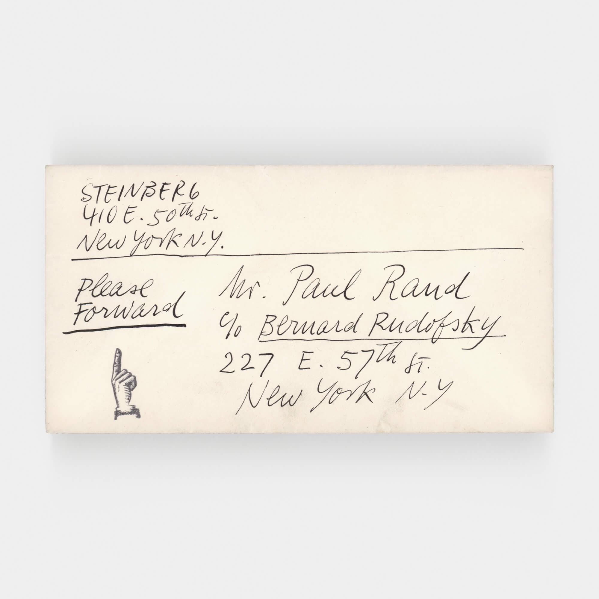 A yellowing envelope with names and addresses written on the front features the symbol of a hand, finger raised upwards.
